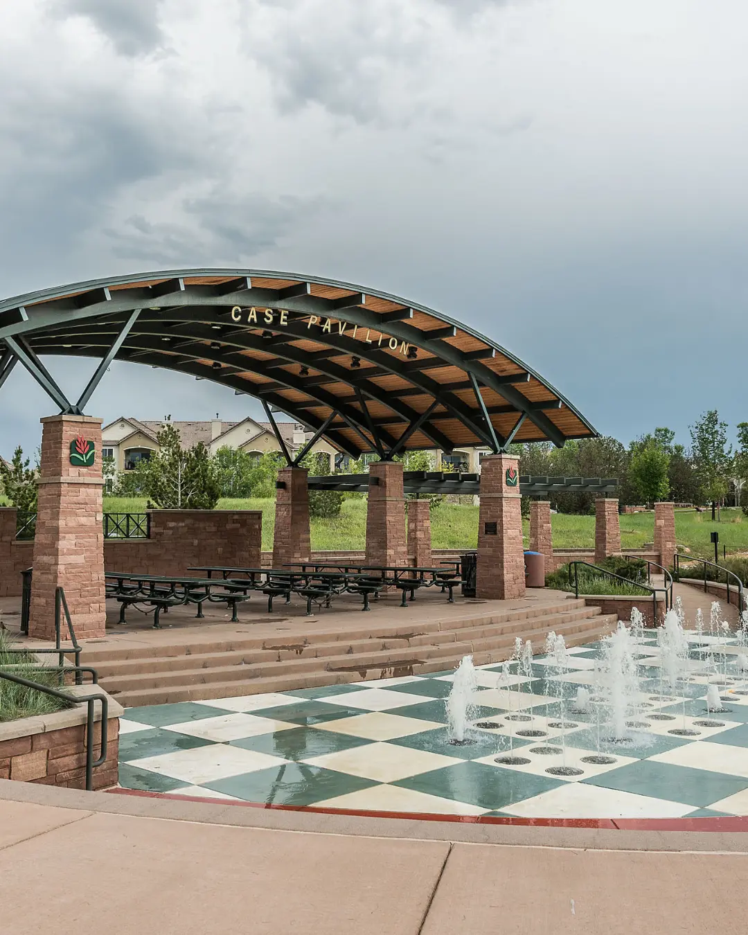 SEO in Highlands Ranch represented by Case Pavilion at Civic Green Park with water fountains in front of the pavilion.